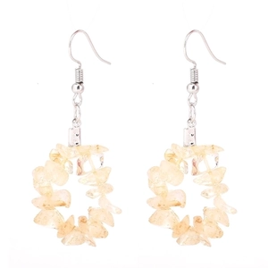 Detailed view of light yellow natural stone beaded drop earrings with silver hooks