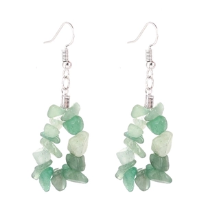 Detailed view of handmade triangular earrings with light green natural stone chips