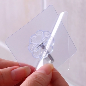 Strong transparent adhesive wall hook with stainless steel hook showing easy peel backing