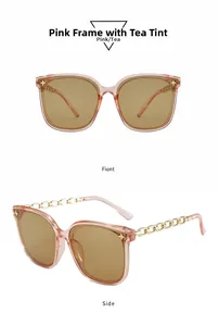 Détails des lunettes de soleil rose avec branches chaîne dorée et verres bruns