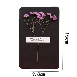 Detailed dimensions of 15x9.8cm black handmade card with pink dried flowers and label