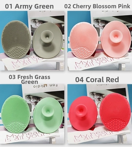 Silicone face cleansing brushes in four colors with soft bristles and suction handle