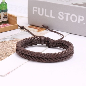 Close-up of brown woven wax cord bracelet with adjustable sliding knot closure
