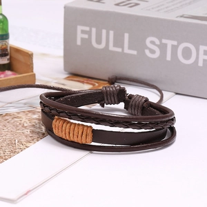Detail of vintage braided leather bracelet with multi-layer texture and adjustable cord