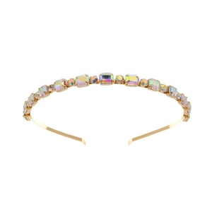 Close-up of golden headband with rainbow rhinestones in square and round shapes