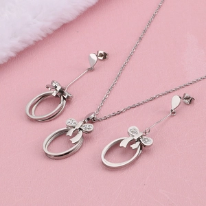 Silver bowknot jewelry set with necklace and earrings featuring pavé cubic zirconia