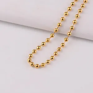 Polished 3.2mm golden ball chain necklace made of round metallic beads on white background