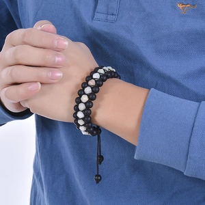 Three-layer beaded bracelet with amazonite and matte black tiger eye stones on wrist