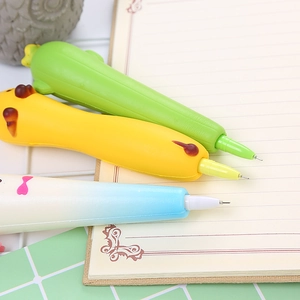 Squeeze stress relief pens in cactus, chick, and bow shapes on an open notebook