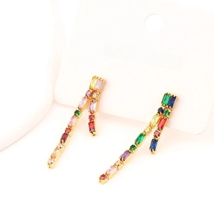 Elegant gold tassel earrings with colorful cubic zirconia stones on jewelry card