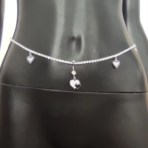 Sexy silver heart pendant belly chain and navel ring set shown on a black mannequin