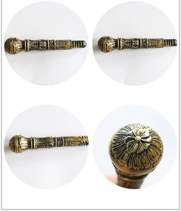 Detailed four-angle view of antique bronze wand handle with ornate floral carvings