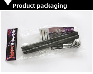 Detailed view of Halloween skull scepter in packaging with assembly instructions