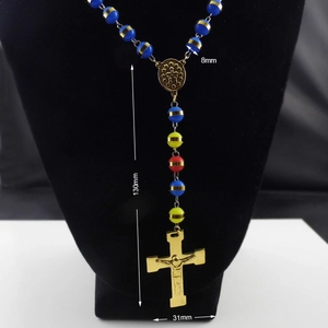 Detailed view of religious rosary beads featuring 8mm colored beads and a 31mm cross