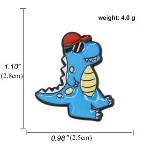 Cute blue cartoon dinosaur enamel pin with sunglasses and red hat measuring 2.8cm