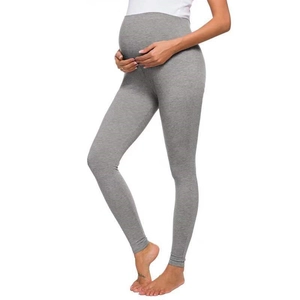 Side view of gray maternity leggings showing high elastic belly support panel and slim fit