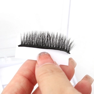Self-adhesive black synthetic fiber false eyelashes on white card for natural eye look