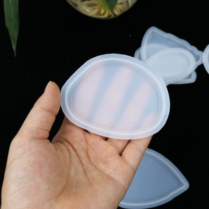 Close-up of flexible translucent silicone mold for DIY resin jewelry and pendant crafting