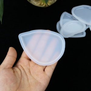 Macro shot of teardrop-shaped silicone mold for DIY resin crystal pendants making