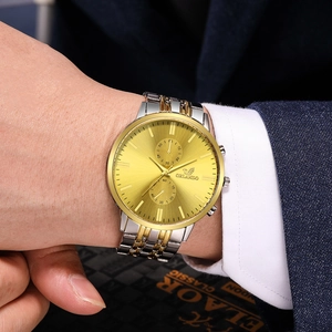 Men's business quartz watch with gold and silver steel band and large textured dial