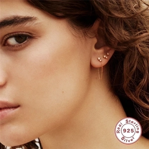 Set of three S925 sterling silver chain tassel and zircon stud earrings on model