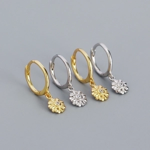 Detailed view of 925 sterling silver flower pendant earrings in gold and silver finishes
