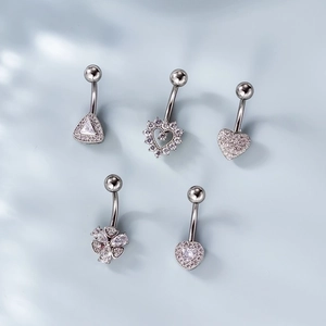 Five-piece stainless steel navel rings set with heart and clover shapes in silver finish