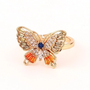 Macro shot of butterfly ring featuring colorful cubic zirconia and gold-plated finish