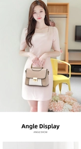Dettaglio dell'elegante borsa a mano bicolore beige e bianca con manici dorati