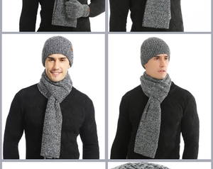 Detail of gray knitted winter set with thick weave texture and leather logo patches