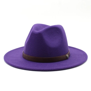 Detail of purple fedora hat featuring a brown woven band and vintage metal buckle