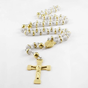 Religious prayer bead necklace with white beads, golden medal and crucifix pendant