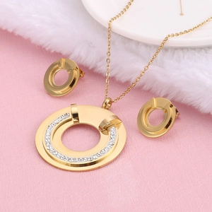 Golden titanium steel jewelry set with sparkling crystals in a hollow circle design