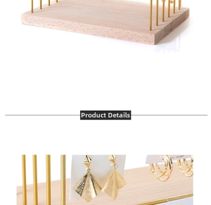 Detail of wooden base earring stand with gold metal rods and S925 silver jewelry