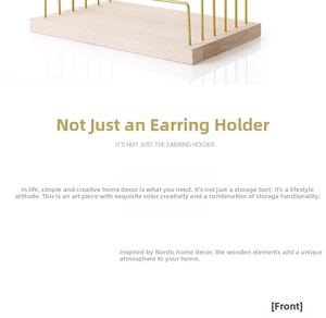 Detail of wooden base and golden iron frames for earring and jewelry display stand