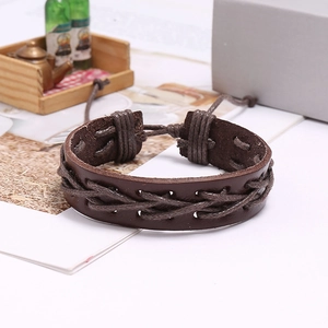 Detail of hand-woven dark brown leather bracelet with adjustable wax rope cord closure