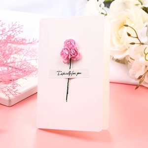 Detail of white greeting card with a pink handmade rose and Especially for you text