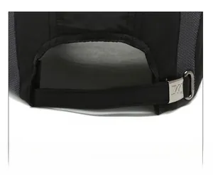 Detail of adjustable metal buckle and breathable mesh on black outdoor baseball cap