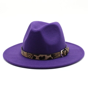 Detail of purple wool felt fedora hat featuring leopard print band and silver buckle