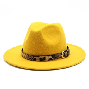 Detailed view of yellow wool felt fedora featuring leopard print band and gold buckle