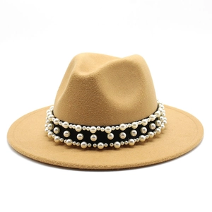 Detail of camel wool fedora hat featuring black band with white pearl embellishments