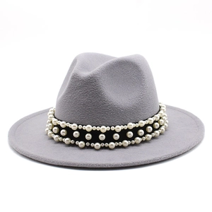 Detail of grey fedora hat with black velvet band and three rows of elegant pearls