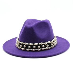 Classic purple fedora wool hat with triple-row pearl decorative band on white background