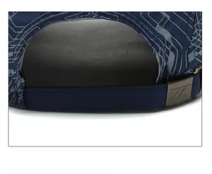Detail of adjustable metal buckle and geometric pattern on navy quick-dry baseball cap