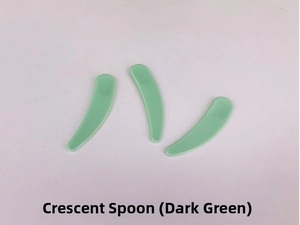 Three translucent mint green crescent spatulas for beauty cream and facial mask application