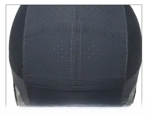 Detail of laser-cut ventilation holes and reinforced double stitching on sports cap