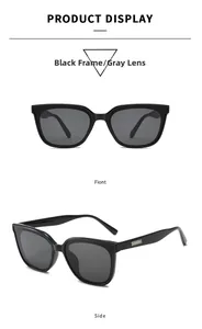 Detail view of large square black sunglasses with elegant silver temple accents