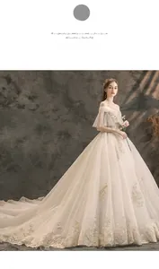 Close-up of champagne lace bridal gown with off-shoulder sleeves and sequin embroidery