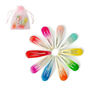 Glittery candy color BB hair clips set with pink mesh pouch on white background
