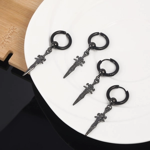 Retro punk black dagger earrings in a set of four on a white ceramic display